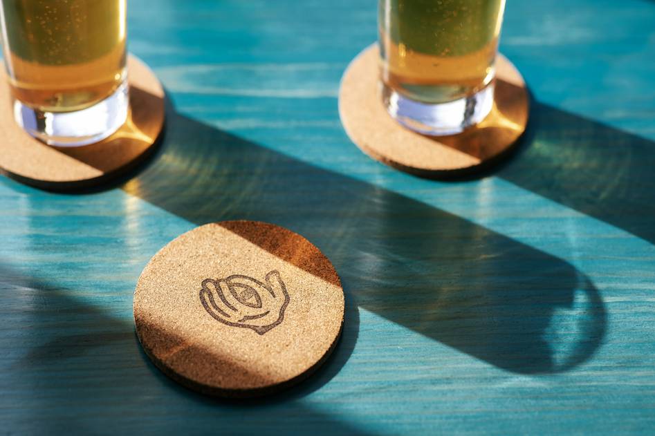 Wooden coasters on rustic table with neutral decor